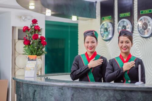 two women standing at a counter in a bathroom at Eurotel Boracay in Boracay