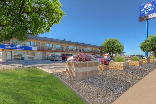 a building with a parking lot in front of it at Americas Best Value Inn Amarillo Airport/Grand Street in Amarillo