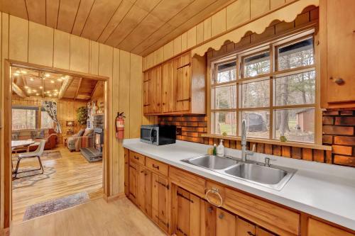 a kitchen with a sink and a counter top at Beartop Lodge Cozy Rustic Cabin Fire Pit in Blakeslee