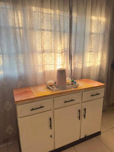 a kitchen counter with a toaster on top of it at 399 Place in Umtali