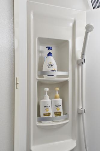 a refrigerator with two bottles of detergents in it at 星宿 Sirius in Asahikawa