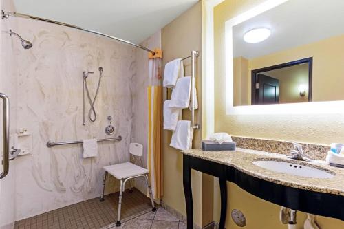 a bathroom with a sink and a shower at La Quinta by Wyndham Denver Gateway Park in Denver