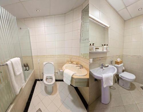 a bathroom with a toilet and a sink and a toilet istg at Luxury Skyline Apartment with Panoramic Views in Sharjah