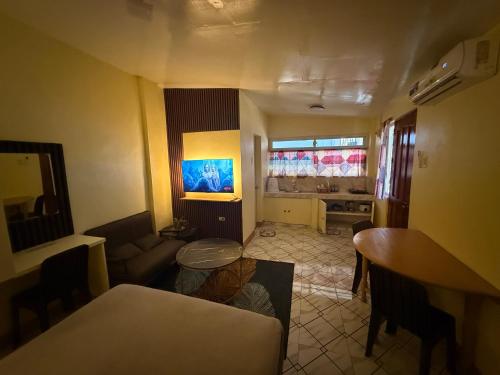 a living room with a couch and a table at Homestay de Baclayon in Baclayon