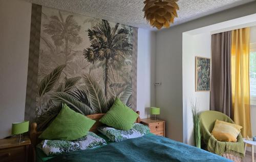 a bedroom with a bed with green pillows at Villa Blu in Sankt Kanzian