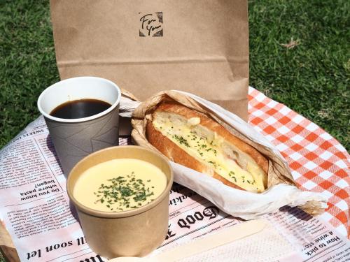 a sandwich and a cup of coffee and a drink at Minn STATION Ai Nagoya in Aoichō