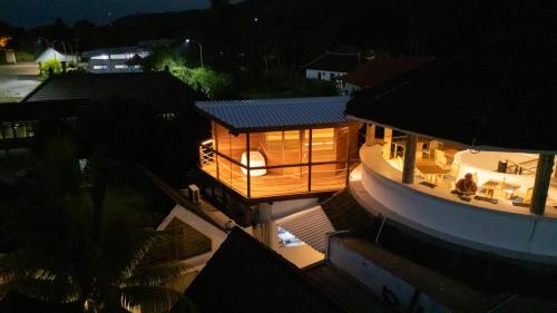 a wooden house on top of a building at night at Segara Seaside Resort in Nusa Lembongan