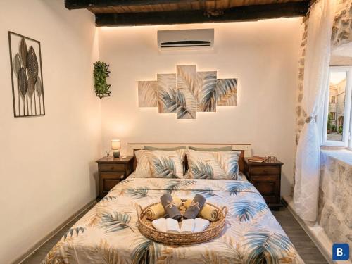 a bedroom with a bed with two teddy bears on it at Stonehouse Kotor Bay in Kotor