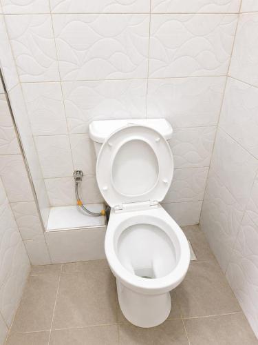 a bathroom with a white toilet in a stall at Phonex haven near Westside Mall in Nakuru