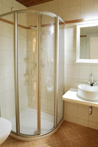 a bathroom with a shower and a sink at Petersenhof in Millstatt