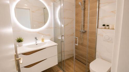 a bathroom with a sink and a shower at Apartment Nana in Primošten