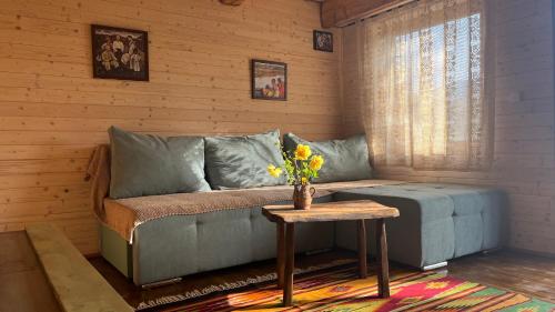a living room with a couch and a table at Breb 220D in Breb