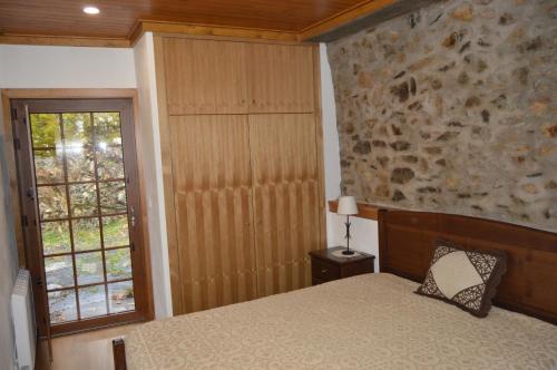 Ένα ή περισσότερα κρεβάτια σε δωμάτιο στο Apimonte Casa do Serra - PN Montesinho