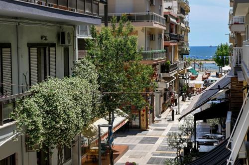 an empty street in a city with buildings at Le Bel Appartement D'Antigoni in Alexandroupoli
