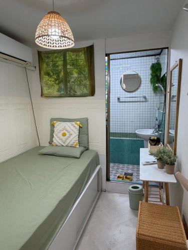 a small room with a bed and a sink at Stay Everyday in Seoul
