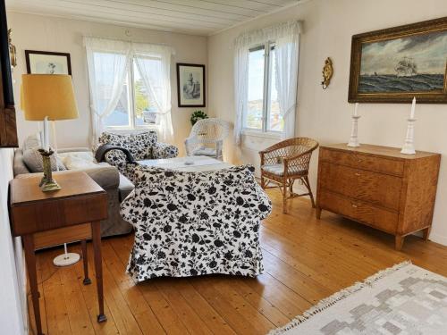a living room with a couch and a table at Charming archipelago house in Grebbestad SE09082 in Grebbestad