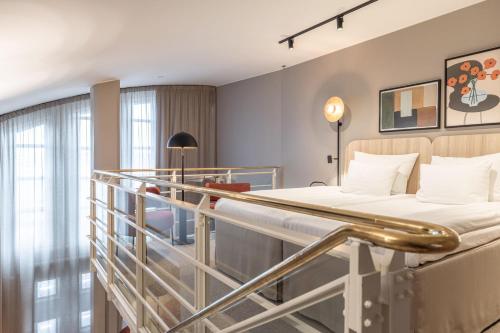 a hospital room with a bed and a balcony at Scandic Grand Marina in Helsinki