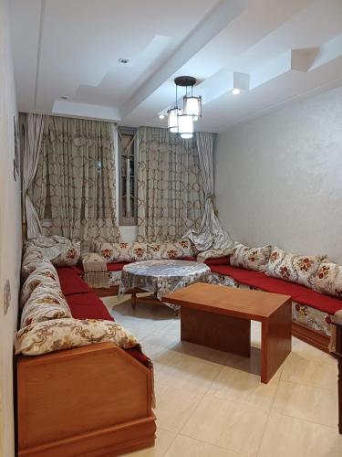 a living room with a couch and a table at Easy Stay Agadir in Agadir