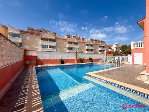 a swimming pool in the middle of a building at Udeville in Oropesa del Mar