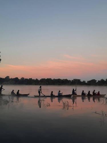 a group of people in boats on the water at Muke Village Guest House in Livingstone