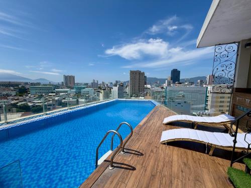 a large swimming pool on top of a building at Corner Central Danang City Hotel in Danang