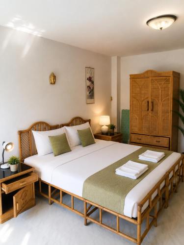 a bedroom with a large bed in a room at View Talay 1B Holidays in Pattaya South