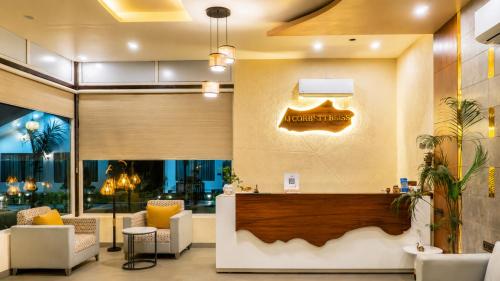 a lobby of a hotel with a waiting area at The JJ Corbett Bliss, Sitabani A River Access Wildlife Resort in Amgarhi