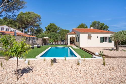 a house with a swimming pool in a yard at SolParc 589 by 3VILLAS in Son Parc