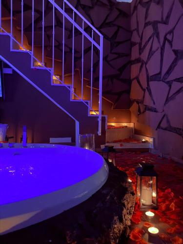 a swimming pool with a staircase in a room at Ama Collection Esclusive Spa in Bologna