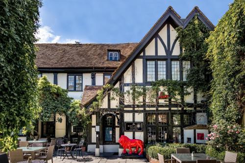 a building with a red animal in front of it at Best Western Red Lion Hotel in Salisbury