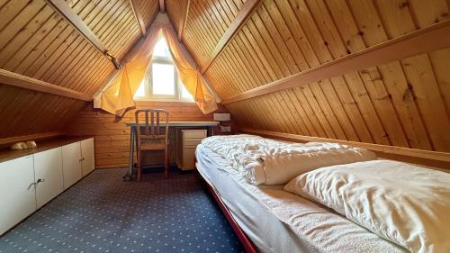 a bedroom with a bed in a room with a window at Casa Ines in Brezzo