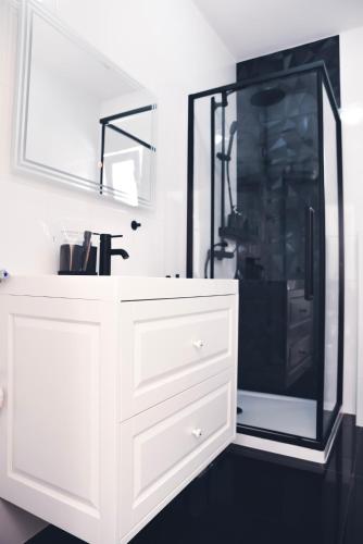 a bathroom with a white sink and a shower at Hvar beach vacation in Vrboska