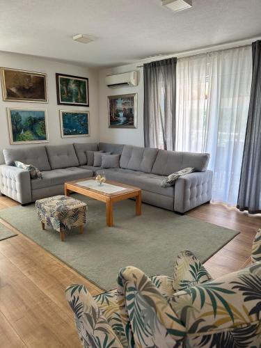 a living room with a couch and a coffee table at Kuća za odmor Nina in Čapljina
