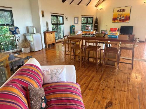 a living room with a couch and a table at Kangela 14 in Ponta Malangane