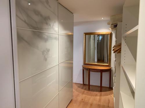a dressing room with a mirror on a wall at Wohnhaus am Marktplatz in Röhrnbach in Röhrnbach