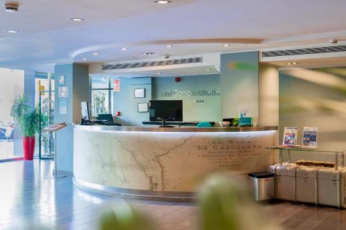 a lobby with a large counter in a building at Hotel Concordia Barcelona in Barcelona