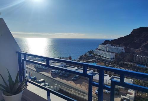 a view of the ocean from a balcony at Roby&Vito Vista Taurito in Taurito