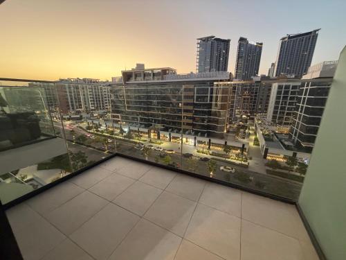a view of a city from the balcony of a building at Azizi Riviera in Dubai