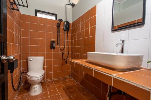 a bathroom with a sink and a toilet at Judy house Betong in Betong