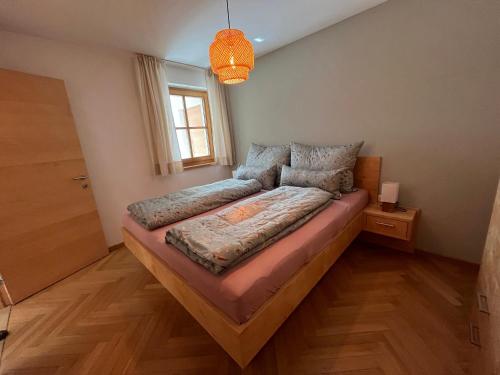 a bedroom with a large bed in a room at Familie Jäger in Innerbraz