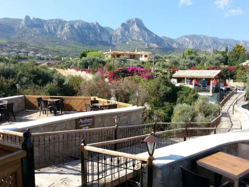 a balcony with a view of the mountains at Kemerli Konak Boutique Hotel in Kérynia