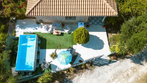 an overhead view of a backyard with a pool at Botonis Houses - Modern Villas, Timeless Beauty in Vasilikos