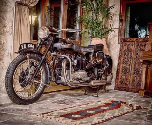 a motorcycle parked in front of a house at Kemerli Konak Boutique Hotel in Kérynia