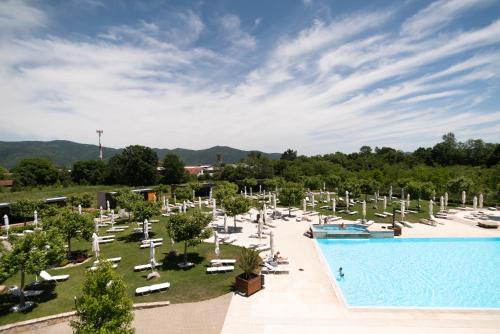 a resort with a swimming pool and lounge chairs at Vrnjačko Vrelo Resort in Novo Selo