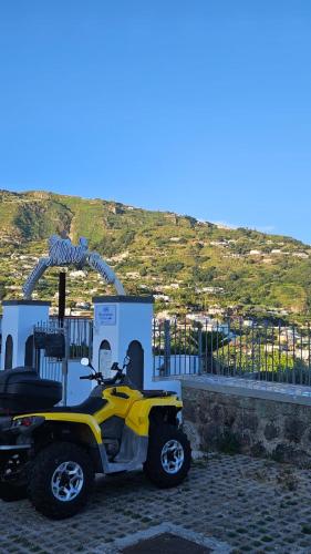 a motor scooter parked in front of a gas station at Residenz e Ristorante da Mimì in Forio d'Ischia