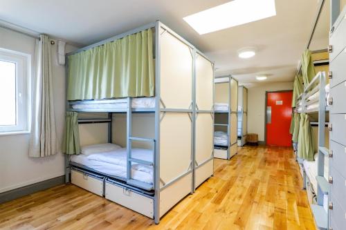 a hallway with bunk beds in a dorm room at Galway City Hostel in Galway