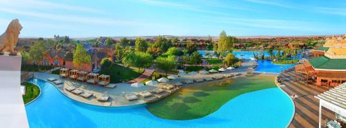 an aerial view of a resort with blue water at Pickalbatros Jungle Aqua Park - Neverland Hurghada in Hurghada