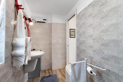 a bathroom with a sink and a toilet at La Mansarda - Terrazze Relax A Due in Cellamare