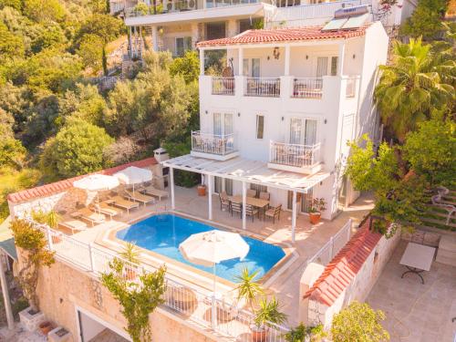 an aerial view of a house with a swimming pool at VILLA LEDA MARE KALKAN Sea View, Private Pool & Beach Clubs in Kalkan