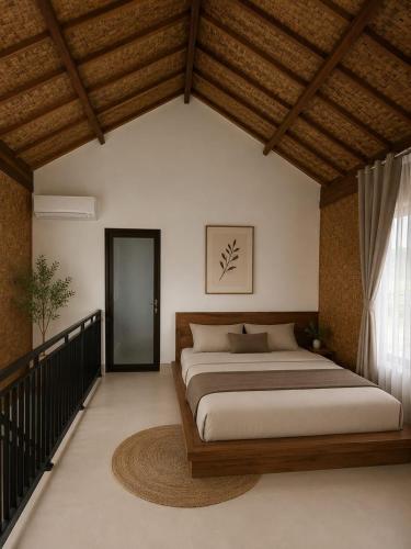 a bedroom with a large bed and a window at PANORAMA BUNGALOWs in Tetebatu